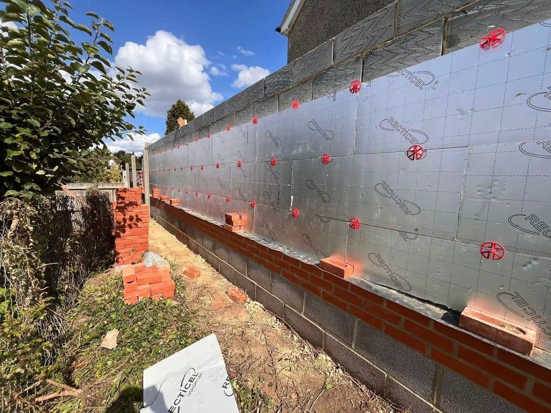 Block walls up, insulation in the cavity