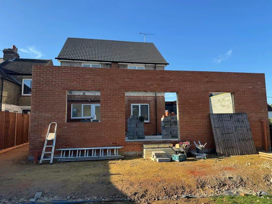 A Dragoi Construction rear extension mid-build, with the walls and openings up