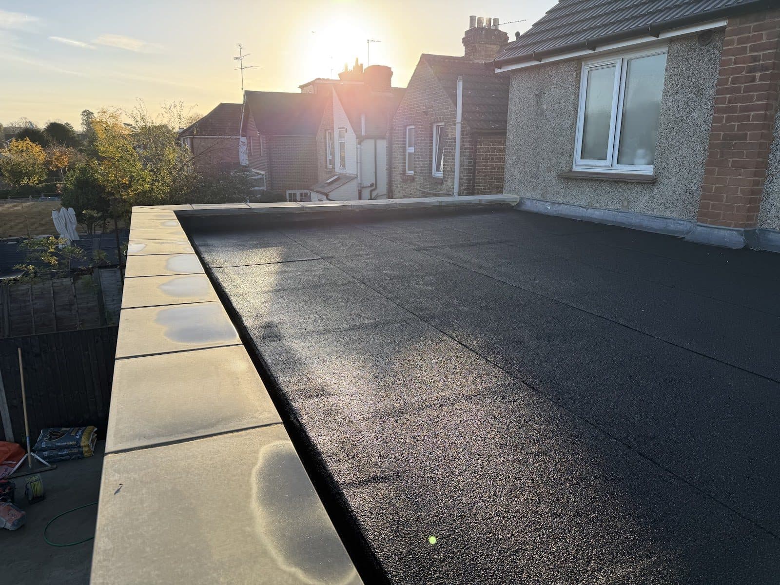 A finished flat roof with stone coping on a rear extension