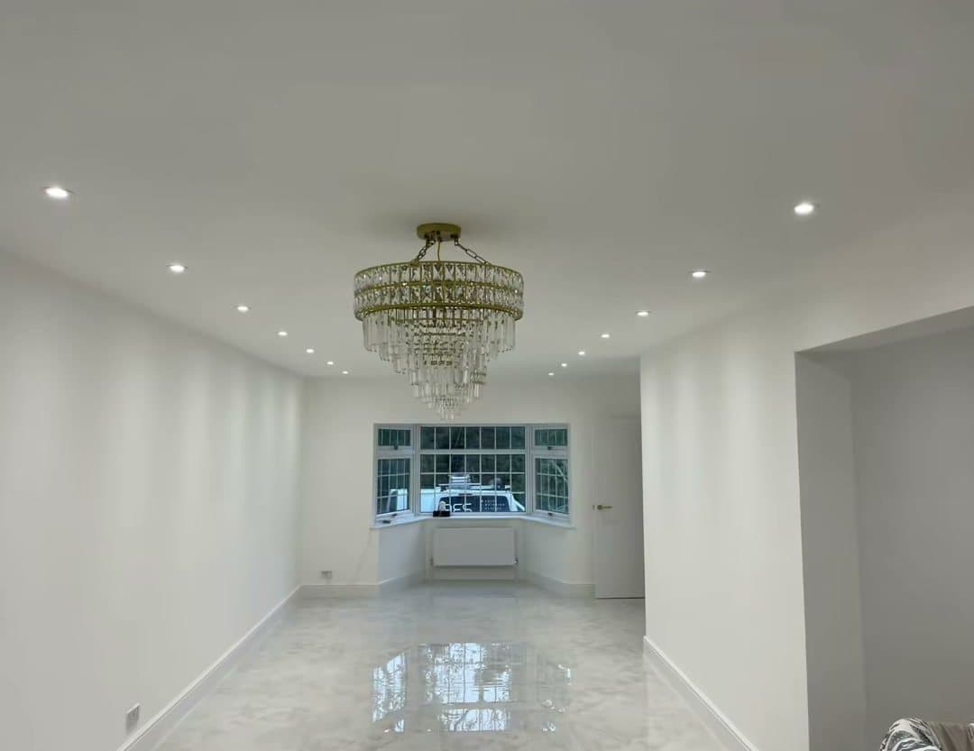 A large open-plan room with a chandelier