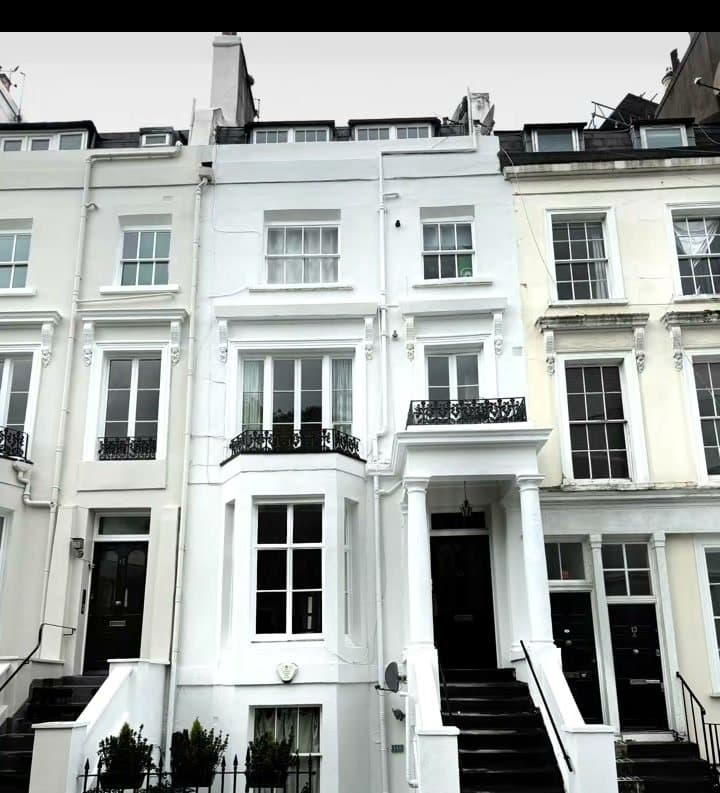 A white townhouse front, finished by Dragoi Construction