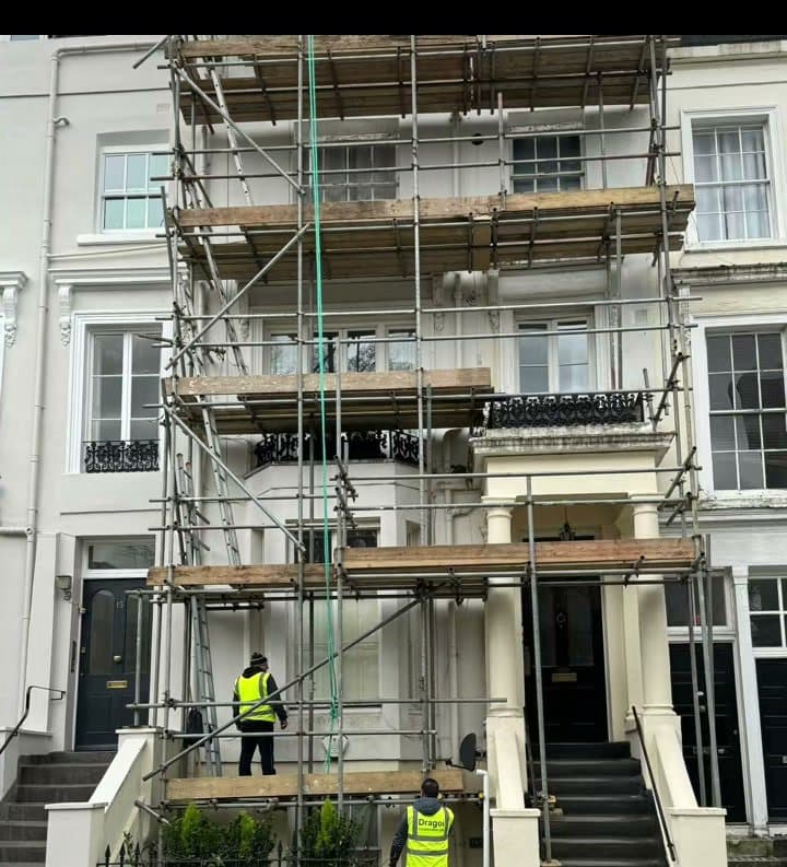 Scaffolding up on the front of a white London townhouse